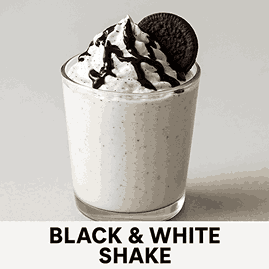A creamy Black & White Shake topped with whipped cream, chocolate drizzle, and a cookie garnish in a glass cup on a neutral background.