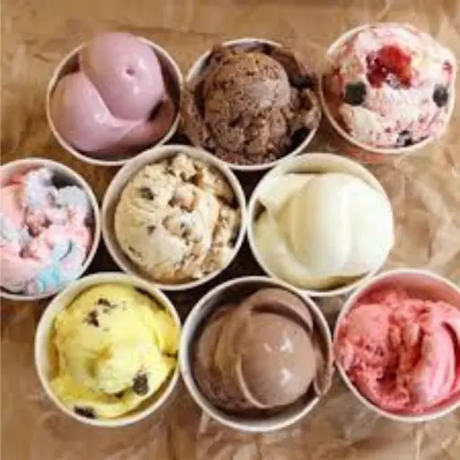 Top-down view of nine assorted ice cream and frozen custard cups featuring various flavors like chocolate, vanilla, strawberry, and cookie dough, representing Shake Shack dessert menu options.