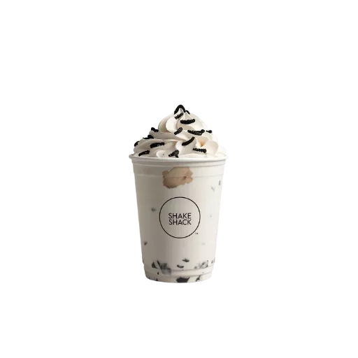Shake Shack cookies and cream shake 2026 with Oreo pieces and whipped cream - hand-spun Oreo milkshake dessert