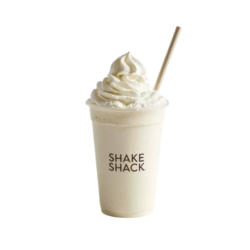 Shake Shack vanilla milkshake with whipped cream topping in clear branded cup with straw - classic hand-spun shake dessert