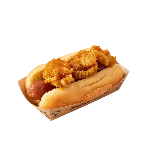 A Shake Shack ShackMeister Dog featuring a split-grilled beef hot dog topped with a generous layer of crispy, ale-marinated fried shallots on a toasted potato bun.