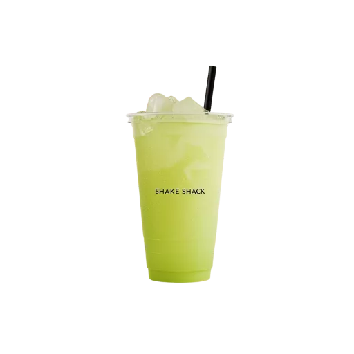 Fresh lime lemonade served over ice in a takeaway cup, featured in a refreshing drinks menu for cafés and restaurants